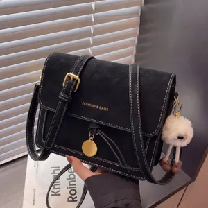 Classic retro black shoulder crossbody small square bag with white stitching detail and furry pendant.