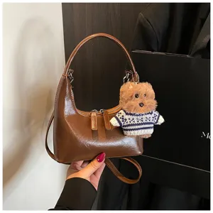 Brown crescent hobo bag with cute bear pendant, vintage commuting shoulder crossbody bag.