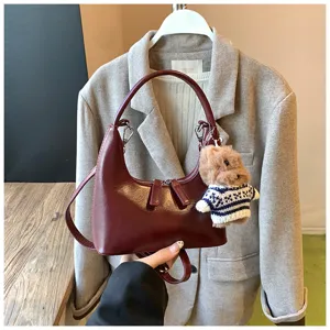 Trendy vintage crescent shoulder bag for women, stylish wine red PU leather handbag with bear.