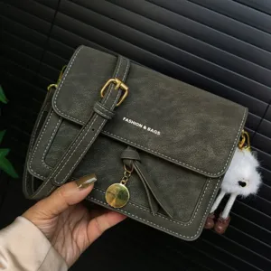 Vintage green shoulder bag with metal buckle and cute fluffy charm for women daily fashion style