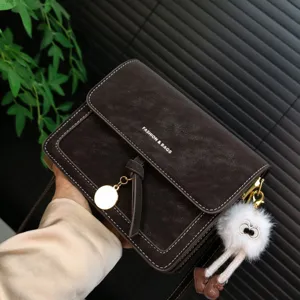 Vintage brown crossbody shoulder bag for women, elegant small square purse with chic pendant.