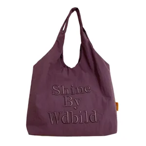 Casual purple canvas tote bag with stylish letter embroidery for daily commuting.
