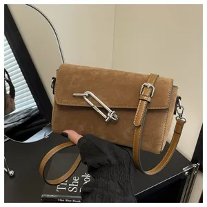 Brown suede crossbody bag with metal lock detail, stylish commuter small square bag for daily use.