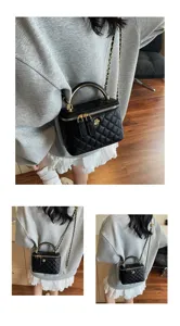 Black quilted chain shoulder bag, classic luxury style cosmetic vanity bag for women.