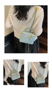 Light blue quilted chain shoulder bag, elegant top-handle vanity handbag for women.