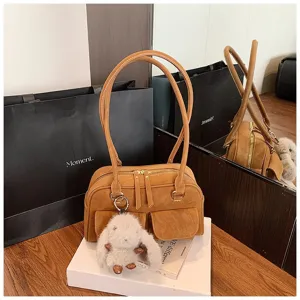 Vintage brown PU leather shoulder bag with dual handles, front pockets and cute bunny charm.