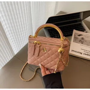 Elegant pink quilted vanity shoulder bag with metallic gold handle and chain strap for chic daily wear