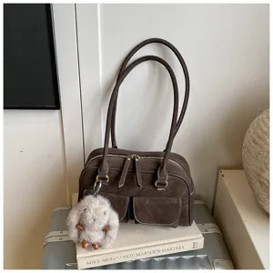 Retro brown shoulder bag for women, large capacity vintage handbag with plush charm detail.