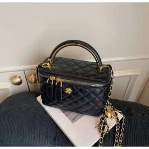 Classic quilted leather vanity shoulder bag with elegant chain strap and gold hardware.