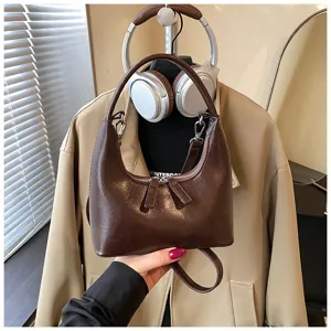 Retro brown hobo shoulder bag for women, stylish crescent PU leather crossbody handbag detail.