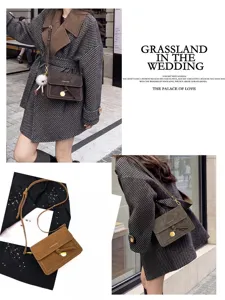 Retro vintage crossbody bag detail, stylish small square purse with metal lock and strap.
