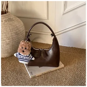 Vintage brown hobo shoulder bag with cute bear charm, stylish daily commuter handbag.