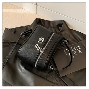 Black retro leather box shoulder bag detail, stylish metal lock and dual zippers design.