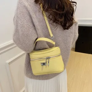 Stylish yellow women's shoulder bag retro top handle crossbody box bag for daily commute.