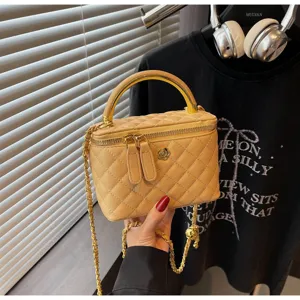 Quilted vanity shoulder bag with chain strap and top handle for women classy fashion purse.