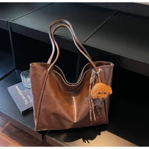 Vintage oil wax leather tote bag for women, large capacity shoulder bag for daily commute.