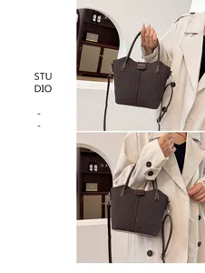 Detailed view of casual brown herringbone shoulder bag, stylish handbag for daily autumn wear.