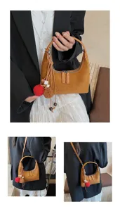 Detailed view of the Korean style minimalist suede hobo handbag with cute furry charm and zipper.
