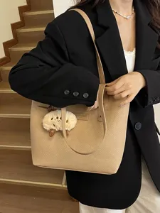 Large capacity PU leather tote bag for women, stylish commuting shoulder bag with cute charm.