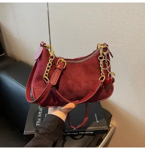 Vintage burgundy suede PU leather shoulder bag with gold chain and cute cherry charm.