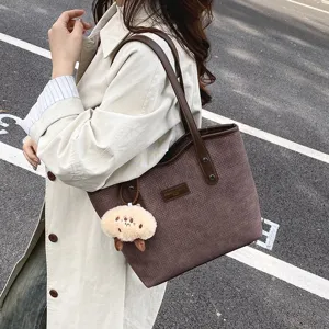 Casual large capacity PU tote bag for women, stylish commuter shoulder bag with cute pendant.