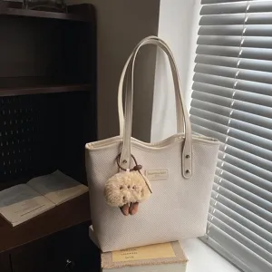 Stylish beige woven tote bag for women, large capacity PU leather shoulder bag commute daily.
