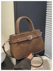Brown suede shoulder bag, commuter top handle bag, stylish belt buckle detail, premium handbag.