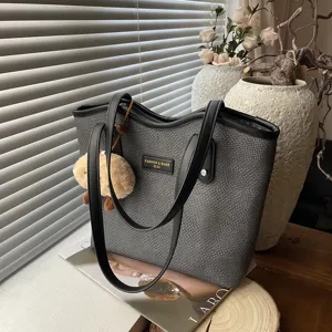 Stylish women's PU leather tote bag, large capacity shoulder bag for daily commuting and fashion.