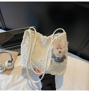 Cute fluffy plush shoulder bag detail with adorable bear pendant, cozy winter handbag texture.