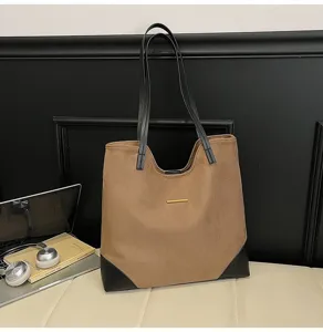 Large capacity brown suede tote bag with black leather trim and casual commuter shoulder design.