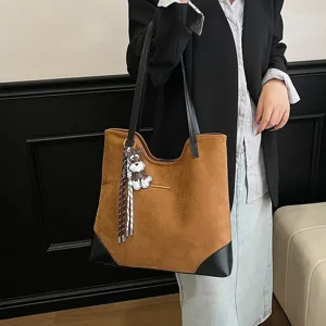 Large capacity suede tote shoulder bag detail view, casual commute handbag with cute pendant.