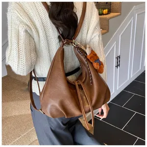 Brown PU leather hobo backpack for women, versatile shoulder bag, autumn winter commuter bag.