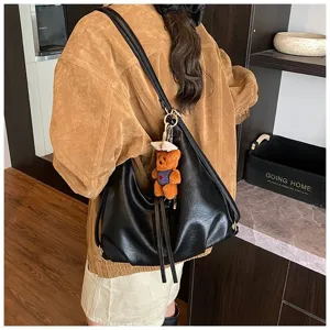 Stylish black PU leather hobo shoulder bag for women, large capacity casual commuting bag.