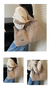 Versatile large capacity Oxford cloth shoulder bag, casual tote and hobo design for daily wear.