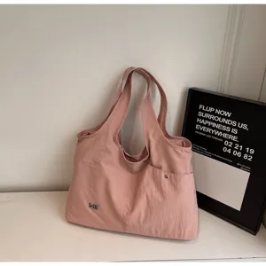 Pink oxford cloth shoulder bag detail, large capacity casual tote bag with front pocket.