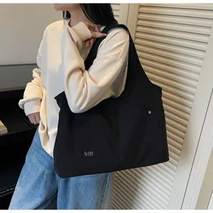 Casual black oxford cloth shoulder bag with large capacity, stylish daily underarm tote purse.