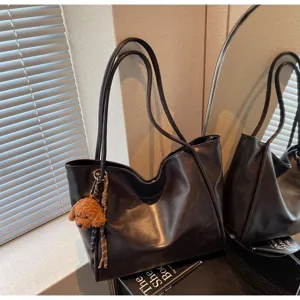 Retro oil wax leather tote bag, large capacity shoulder bag with cute plush puppy pendant.