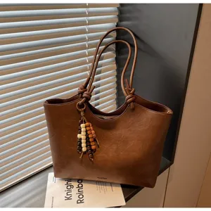 Vintage brown PU leather tote bag for women, large capacity shoulder bag with wooden bead charm.