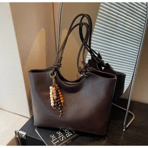 Classic dark brown vintage tote bag for women, large capacity shoulder bag with chic beaded charm.