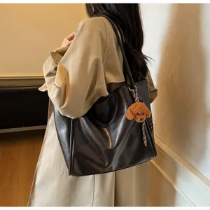 Detailed shot of retro oil wax leather tote bag, large capacity single shoulder commuter bag.