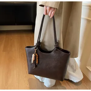 Vintage brown tote bag for women, large capacity stylish shoulder bag with wooden bead charm.