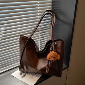 Retro oil wax leather tote bag with cute poodle plush pendant, large capacity shoulder.
