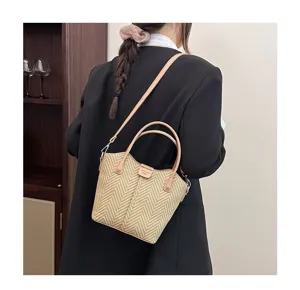 Stylish straw woven crossbody shoulder handbag with leather handles for women casual daily use.
