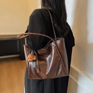Vintage oil wax leather tote bag for women, large capacity shoulder commuting handbag.