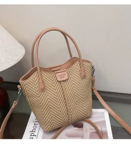 Detailed view of casual woven straw shoulder bag with leather handles and strap for daily wear.