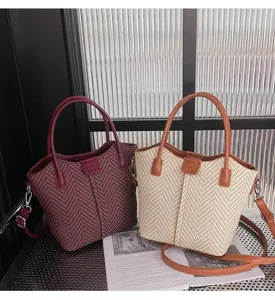Stylish woven tote shoulder bag for women, casual handbag with top handle and strap.