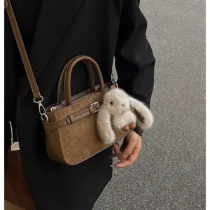 Brown suede shoulder bag women autumn winter vintage crossbody handbag with cute plush rabbit charm.