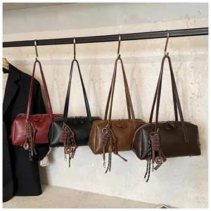 Retro PU leather bowling shoulder bag for women, vintage underarm pillow bag with charms.