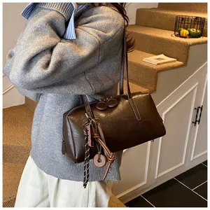 Retro brown bowling bag PU leather shoulder bag stylish commuter pillow handbag for women.