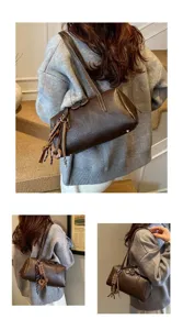 Retro PU leather bowling shoulder bag for women, chic underarm pillow handbag with cute charm pendants.